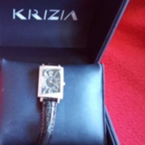 Fashion watch; silver square face with crystals